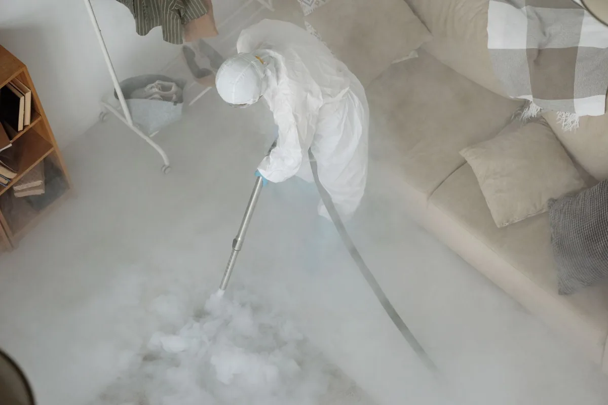 Biohazard cleanup technician in protective equipment, Alexandria, TN